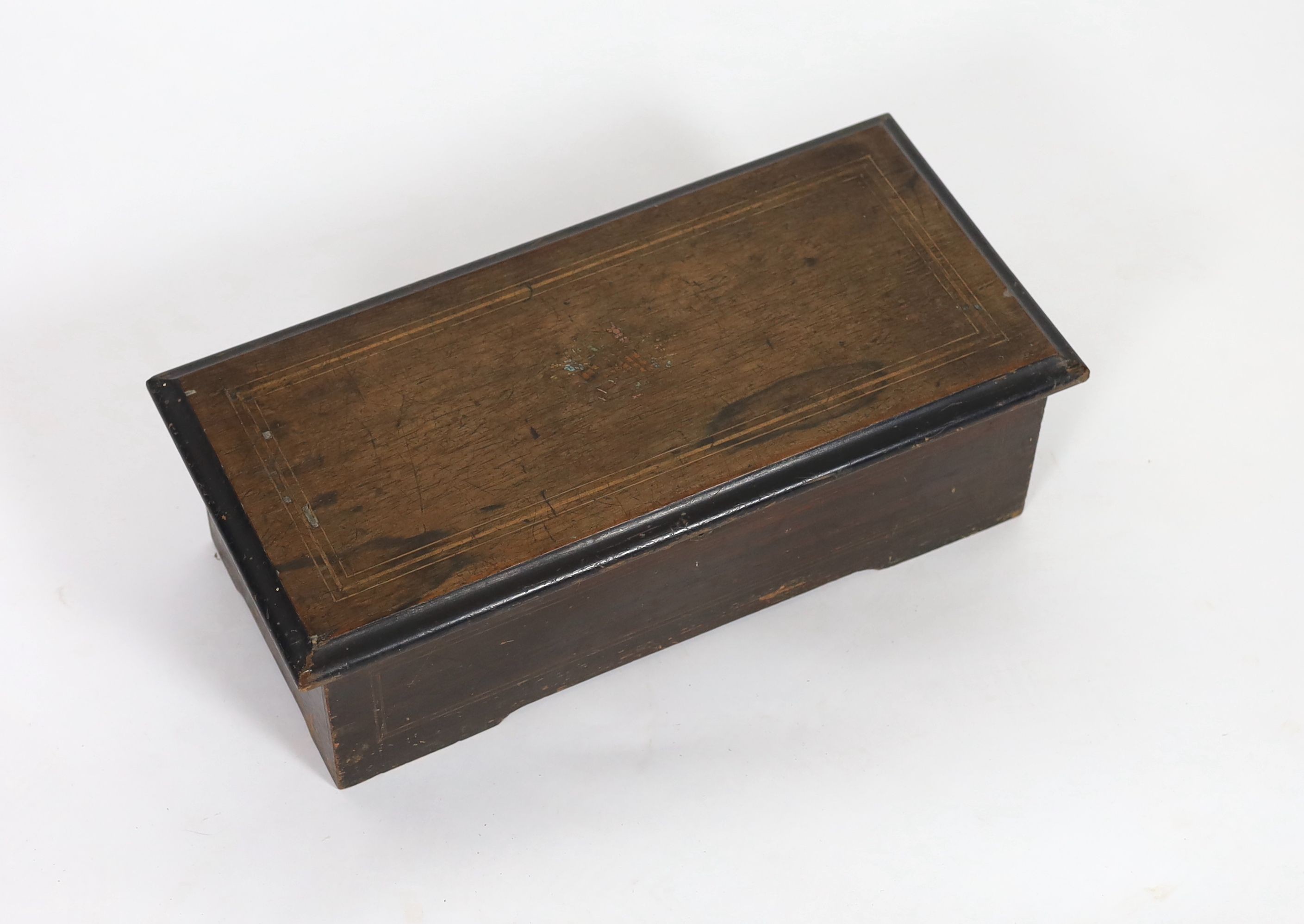 A late 19th century Swiss music box, with 18cm cylinder, in inlaid walnut and simulated walnut case, width 49cm
